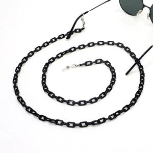 Close-up of gloss black acrylic glasses chain with non-slip silicone loops and metal springs