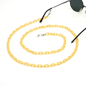 Yellow acrylic eyeglass chain with classic links and non-slip silicone loops detail