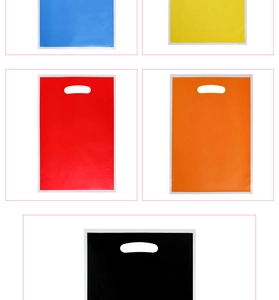 Detailed view of colorful pearlescent plastic gift bags in blue, yellow, red and orange