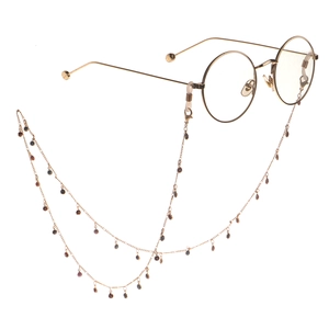 Gold metal eyeglasses chain with blue sunflower pendants and silicone anti-slip loops
