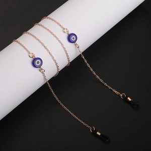 Chaîne à lunettes dorée avec perles œil bleu et fixations en caoutchouc noir