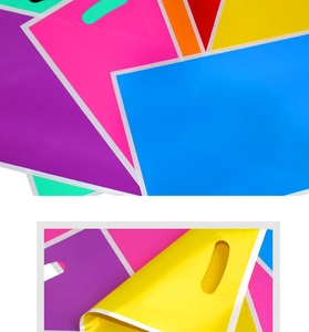 Macro shot of colorful pearlescent plastic gift bags showing flexible texture and handles