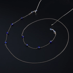 Elegant gold-tone eyewear chain with blue evil eye beads and adjustable silicone loops