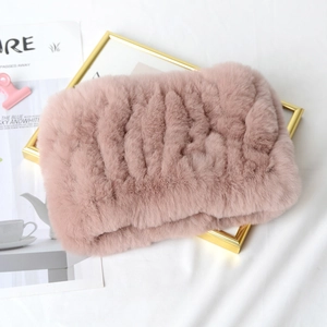 Close-up of pink knitted faux rabbit fur neck warmer showing plush texture and weave