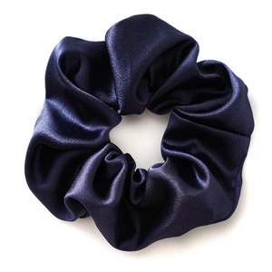 Elegant navy blue satin hair scrunchie with crystal luster finish on white background