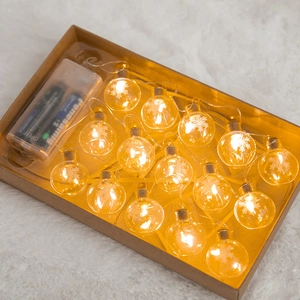 Nordic LED Christmas snowflake string lights in warm yellow with craft paper box