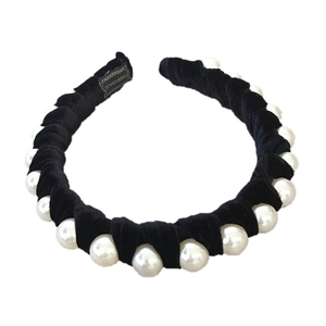 Elegant black velvet headband with large white pearl accents in a twisted queen style