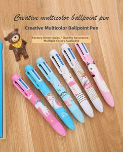 Set of 6 cartoon flamingo and unicorn 6-color ballpoint pens on a wooden desktop