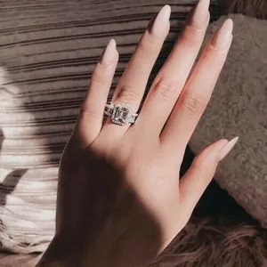 Luxury emerald cut zircon ring for women with halo setting and pavé crystals on the band