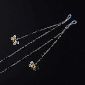 Rutschfeste goldene Brillenkette mit farbigen Bienenanhängern und Silikonschlaufen