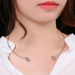 Silver stainless steel choker necklace with square rhinestones worn by a female model