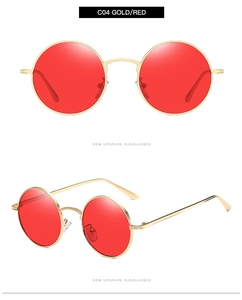 Detail view of round gold metal sunglasses with red lenses from front and side angles