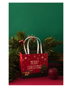 Red Christmas gift bag with Merry Christmas print and festive holiday patterns