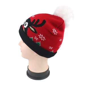 Winter unisex knitted Christmas beanie with red reindeer patterns and white pompom
