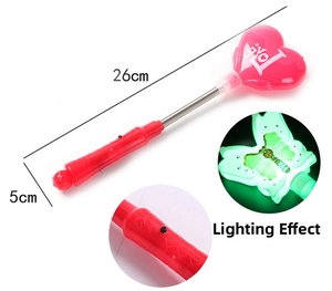 Detail of red heart LED fairy wand with Love text, spring neck, and power button