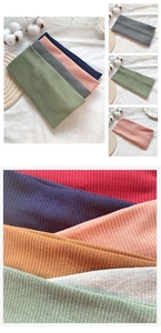 Detailed macro view of soft ribbed knit fabric texture and elastic headband material
