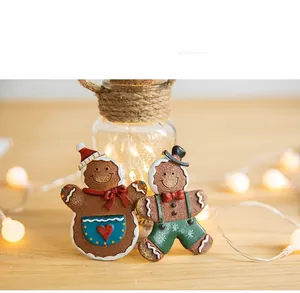 Festive gingerbread man figures with scarves and hats for Christmas home decor