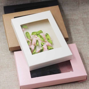 Detail of kraft gift boxes with PVC windows in white pink brown and black colors
