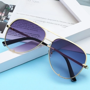 Classic aviator sunglasses with gold metal frame and blue-purple gradient lenses