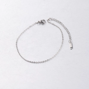 Detailed shot of polished stainless steel link chain bracelet with lobster clasp