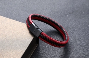 Detail of red and black braided leather bracelet with a matte black magnetic clasp