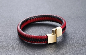 Close-up of red and black braided leather bracelet with golden magnetic metal clasp