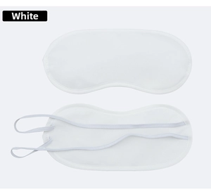 Close-up of white polyester sleep mask with elastic headbands for travel and comfort