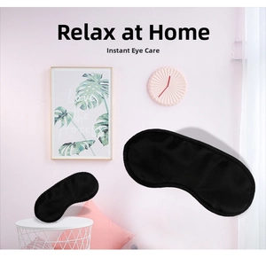 Breathable black sleep eye mask showing soft texture and ergonomic shading design