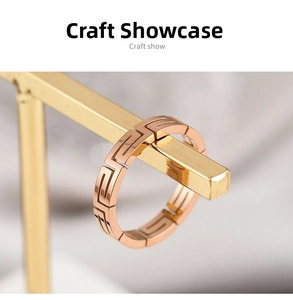 Macro detail of rose gold titanium steel ring featuring geometric Greek fret pattern