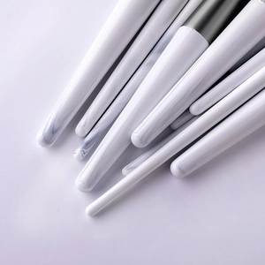Set of 12 makeup brushes with white marble pattern handles and soft bristles