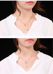Collana a doppio strato con stella e ciondolo pianeta perlato in oro e argento