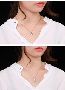 Close-up of rose gold and silver devil's eye teardrop necklaces on female models