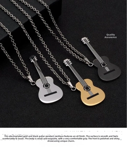 Detailed close-up of guitar-shaped pendant necklaces in gold, silver and black finishes