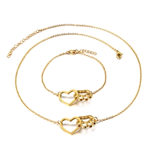 Goldenes Set aus Halskette und Armband mit Herz- und Pfotenanhängern sowie Verlängerung
