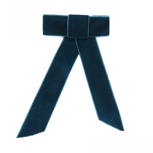 Deep blue velvet bow hair accessory shown in four color options with ribbon detail