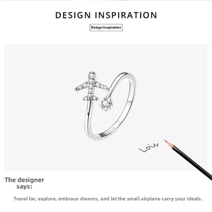 Close-up of S925 sterling silver airplane ring with sparkling zircon stones and design sketch