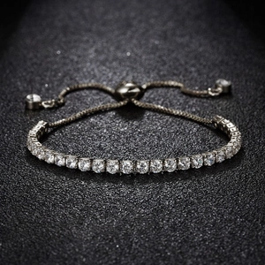 Detail view of silver tennis bracelet with 3mm cubic zirconia and adjustable drawstring clasp