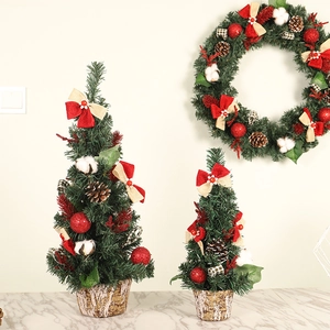 Miniature Christmas trees and wreath with pine cones, berries and cotton on wood base