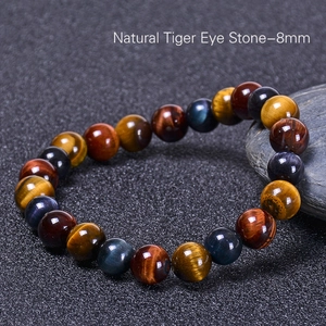 Macro view of 8mm natural tiger eye stone bracelet with colorful silk luster beads