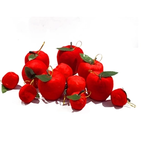 Close-up of red flocked Christmas apple ornaments with gold hanging strings in bulk