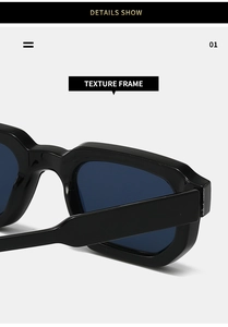 Close-up of the textured black frame and dark blue lenses of these retro square sunglasses