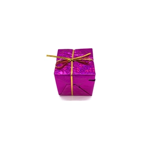 Detail of rose red laser gift box with shiny texture and a golden bow for Christmas decor