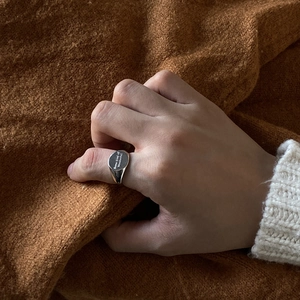 Detailed close-up of a 925 sterling silver ring with Some kind of Wonderful engraving