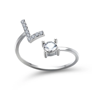 Detailed macro of S925 silver adjustable ring featuring a diamond-encrusted letter L and main stone