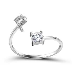 Detailed view of silver adjustable ring featuring a pavé-set letter and a round zircon stone
