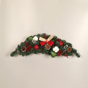 Christmas door garland with pine cones, cotton flowers and red gold bows on plain background