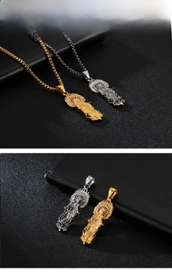 Close-up of Virgin Mary pendant with cubic zirconia inlay in gold and silver finish