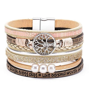 Detail of bohemian multilayer leather bracelet featuring tree of life and magnetic clasp