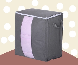 Detail of grey non-woven storage bag with clear PVC window and reinforced handles
