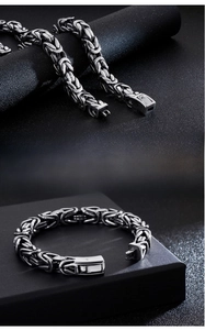 Detail showing vintage Byzantine weave titanium steel chain and secure clasp for men